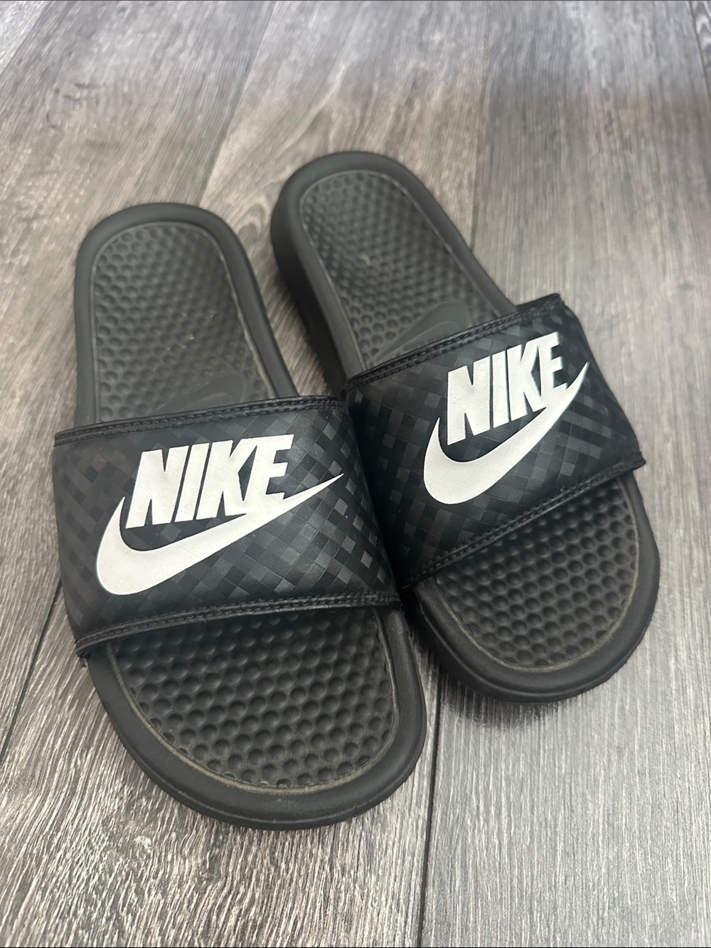 Nike Black Slides with White Swoosh Logo